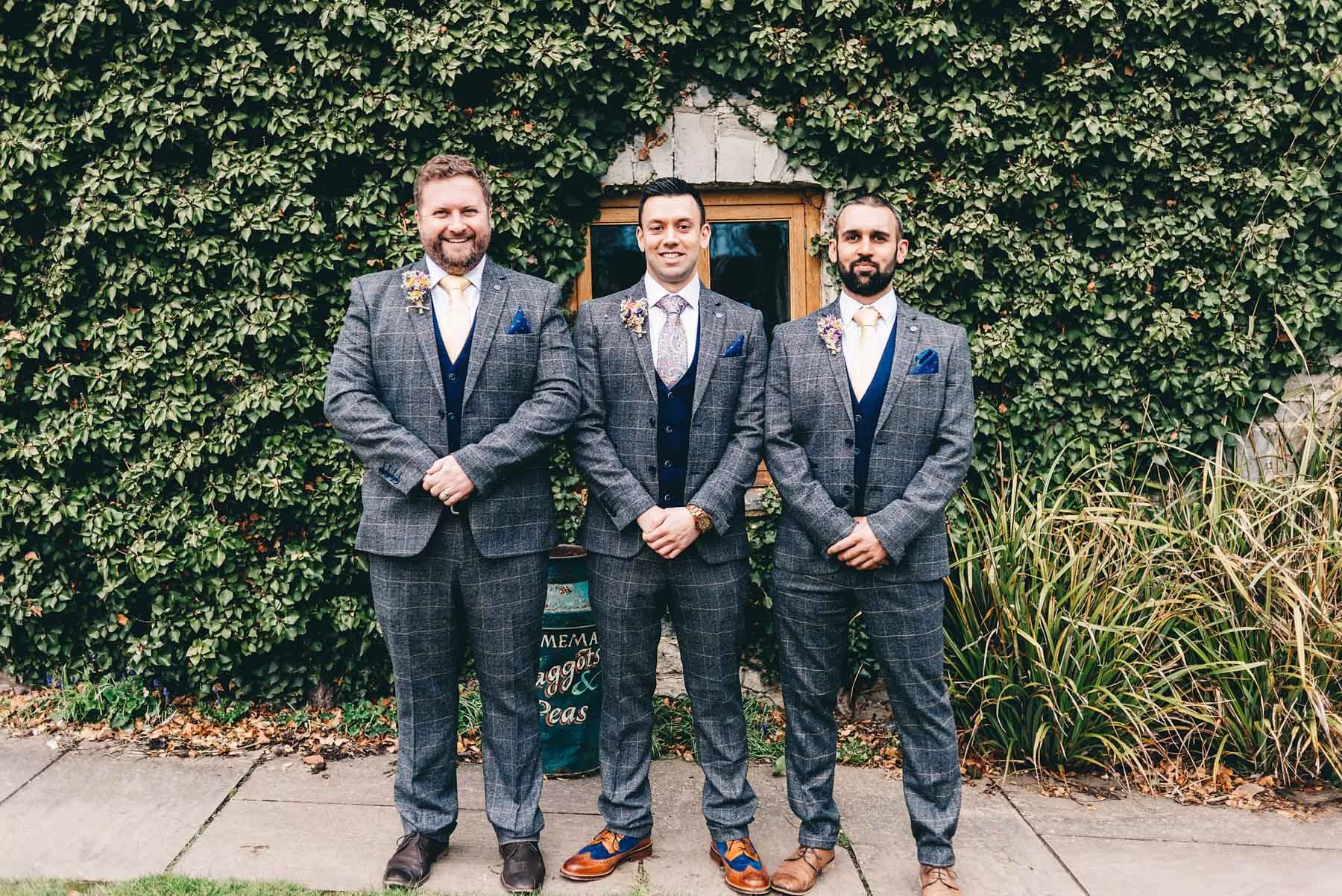 Groom and groomsmen pose for photo in Rosedew Farm Llantwit Major