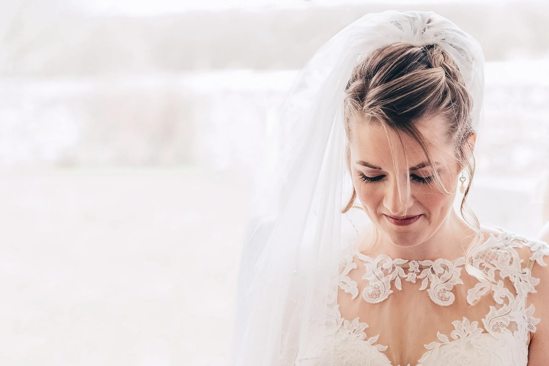 Bridesmaids and Mother of the bride help get beautiful bride get ready, In Rosedew Farm Llantwit Major South Wales