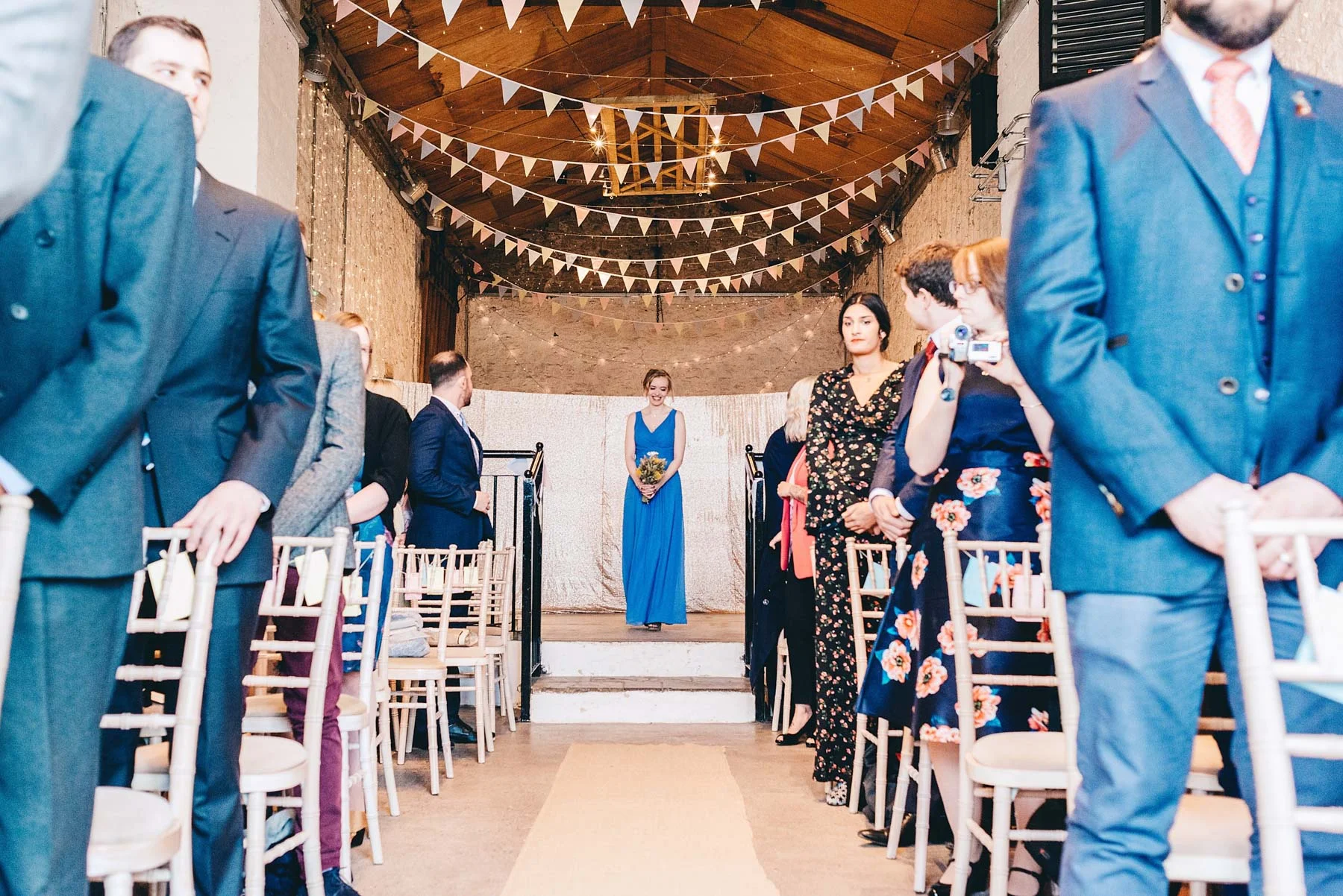 Bridesmaid walks down the aisle