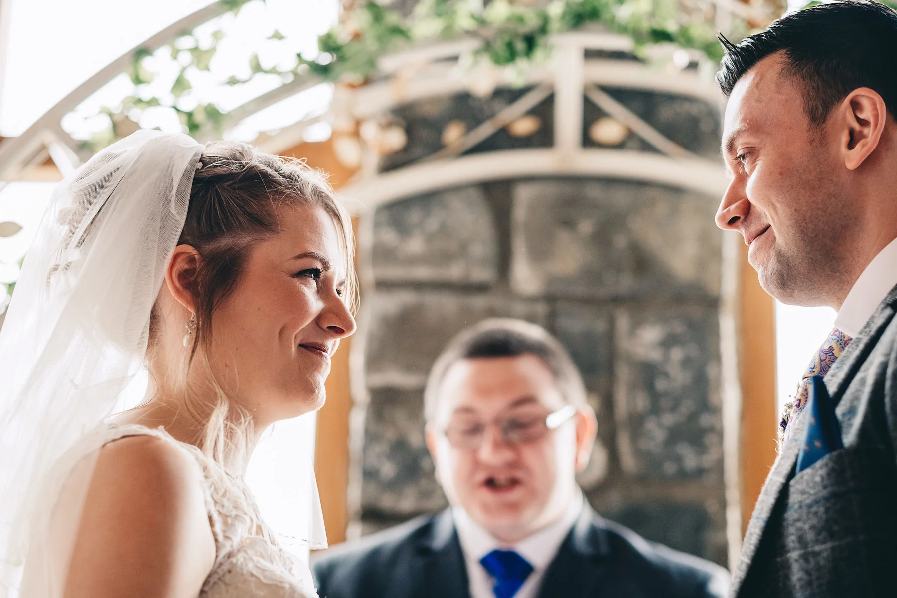 Bride and groom look at each other lovingly