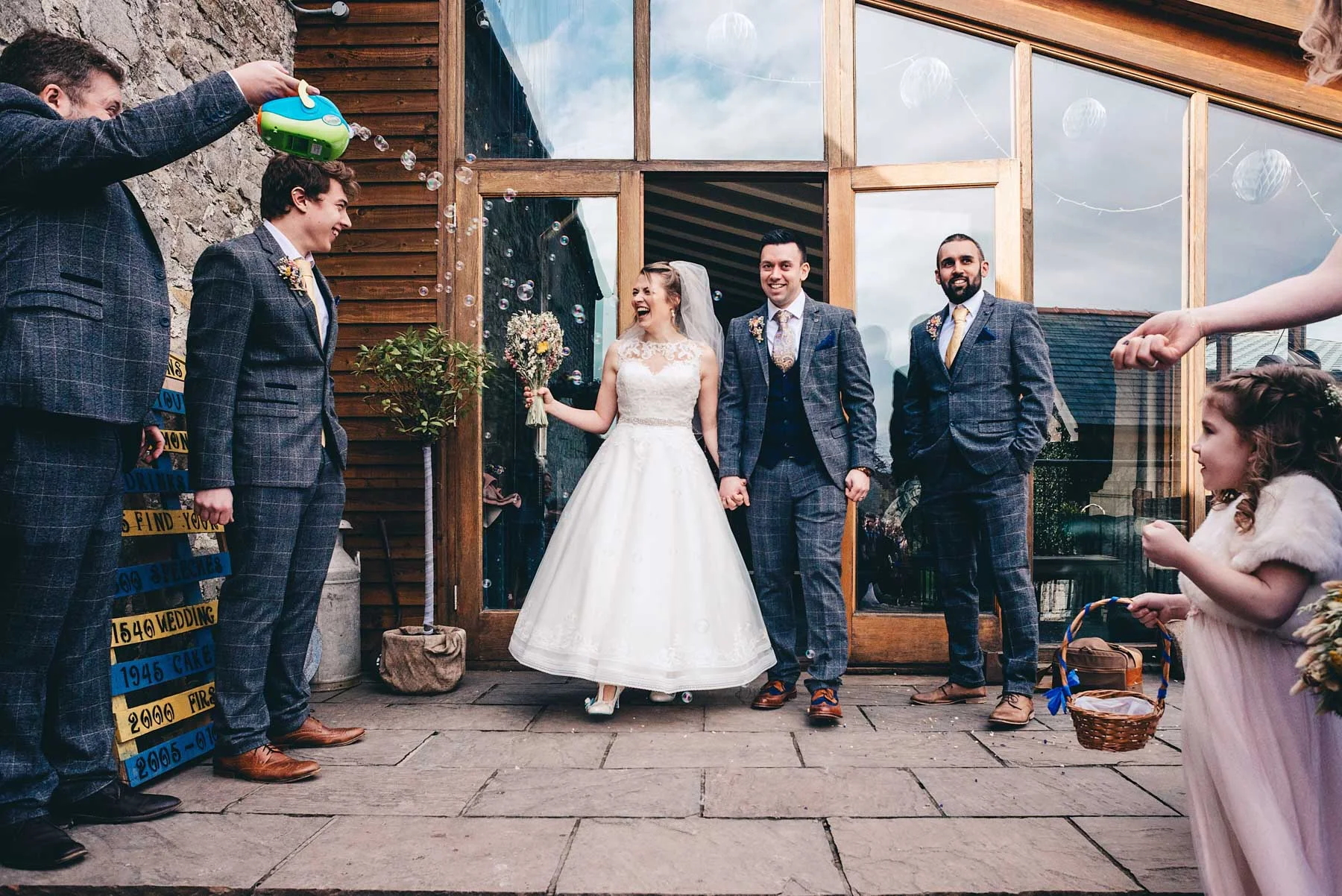 Bride and Groom have confetti thrown at them
