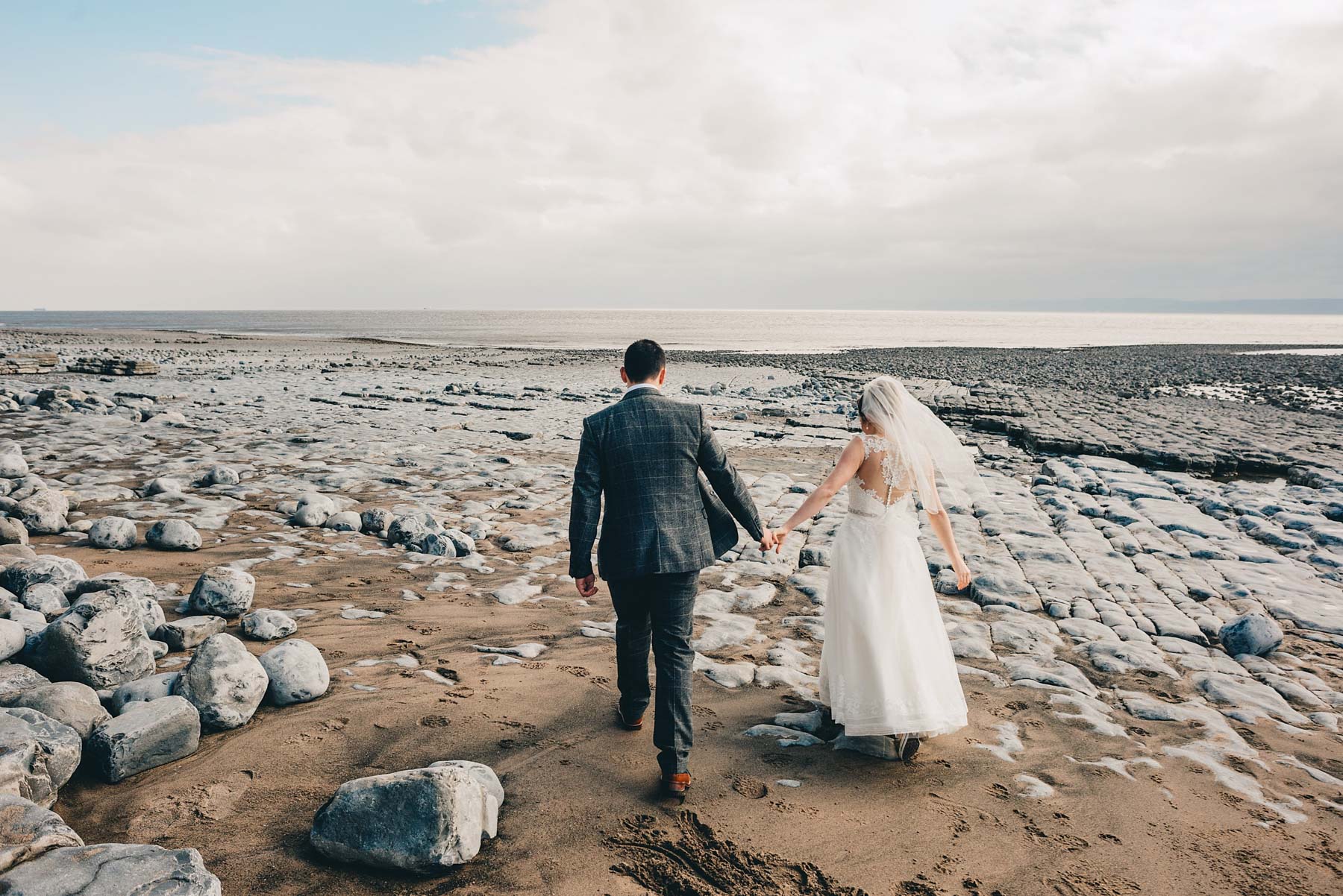 Bride and Groom walk out to the coast in Llantwit Major, South Wales