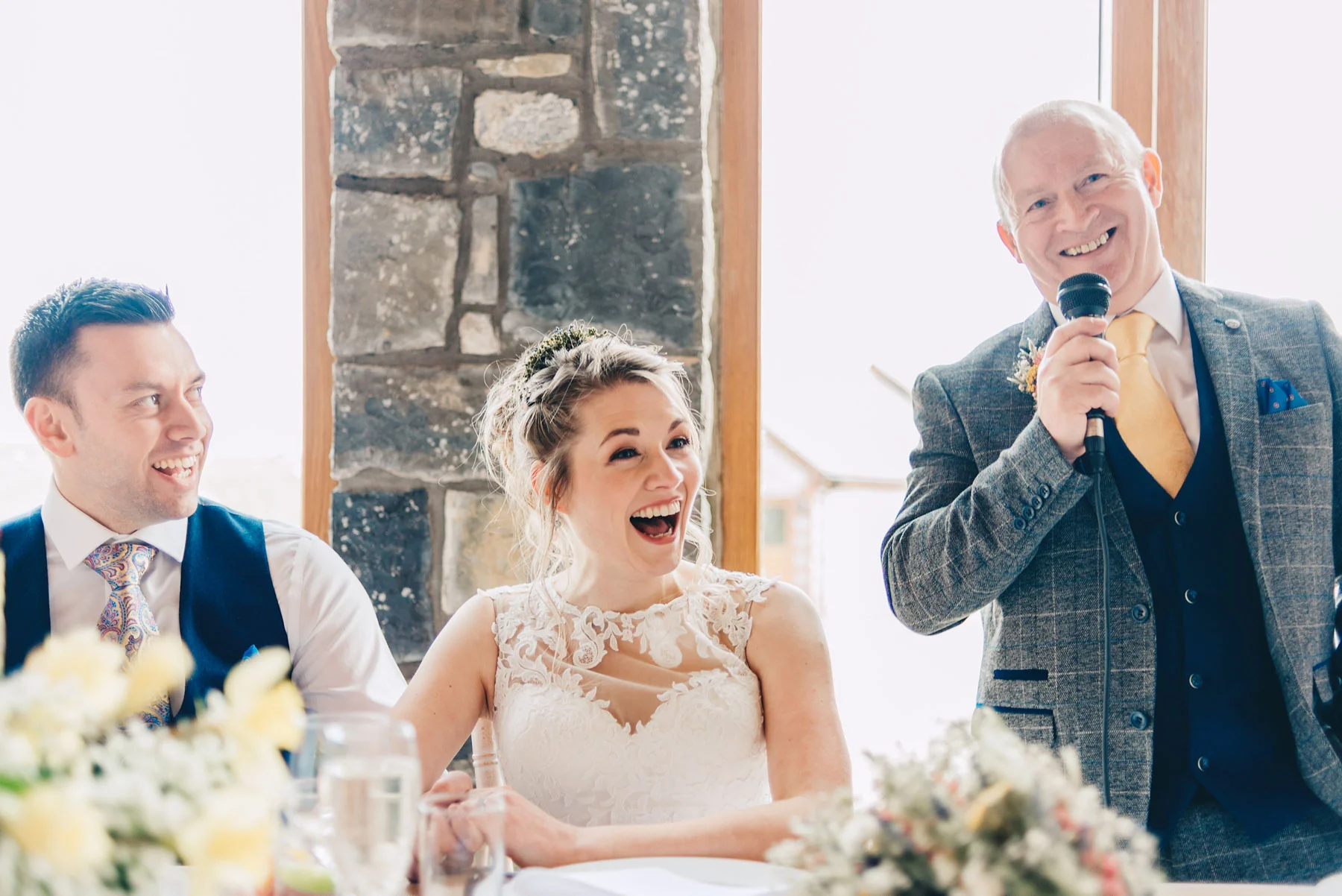 Bride laughs as Father of the Bride gives his speech