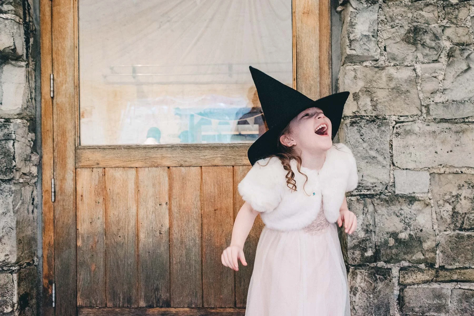 Girl laughs at wedding