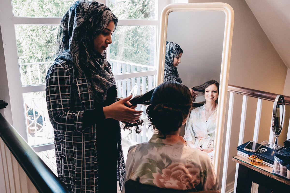 Bride getting her hair styled