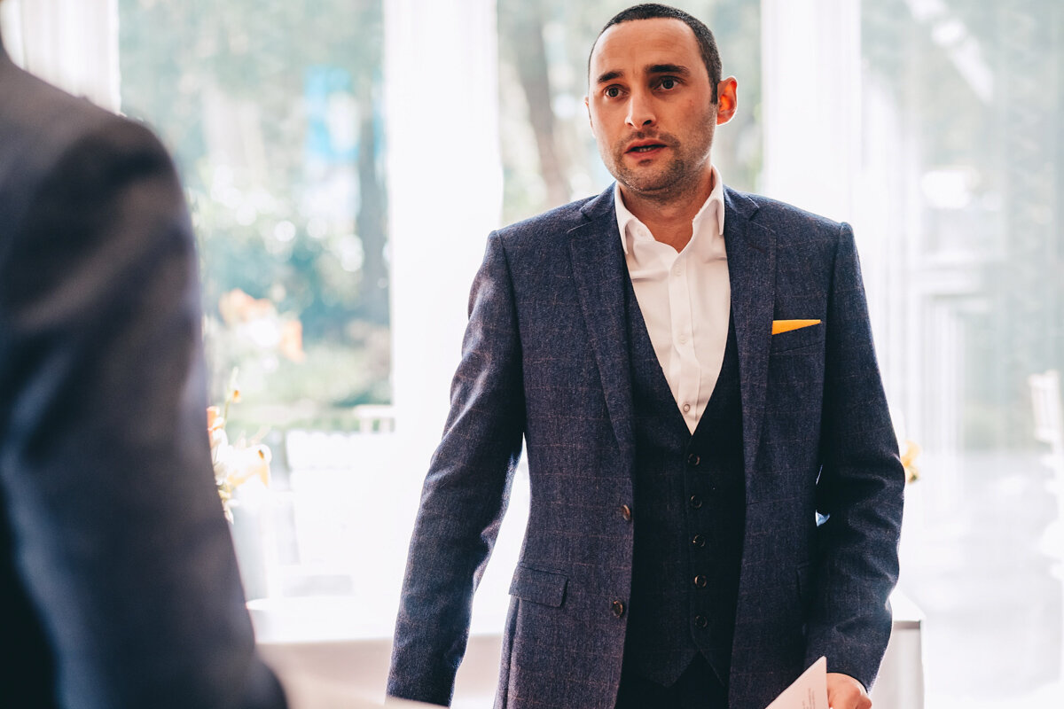 Groom talks to groomsmen