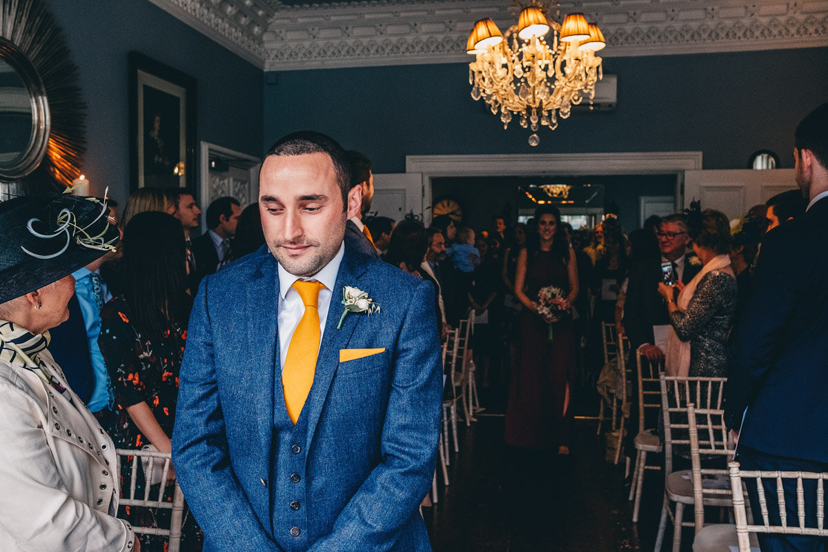 Groom waits nervously as the ceremony starts