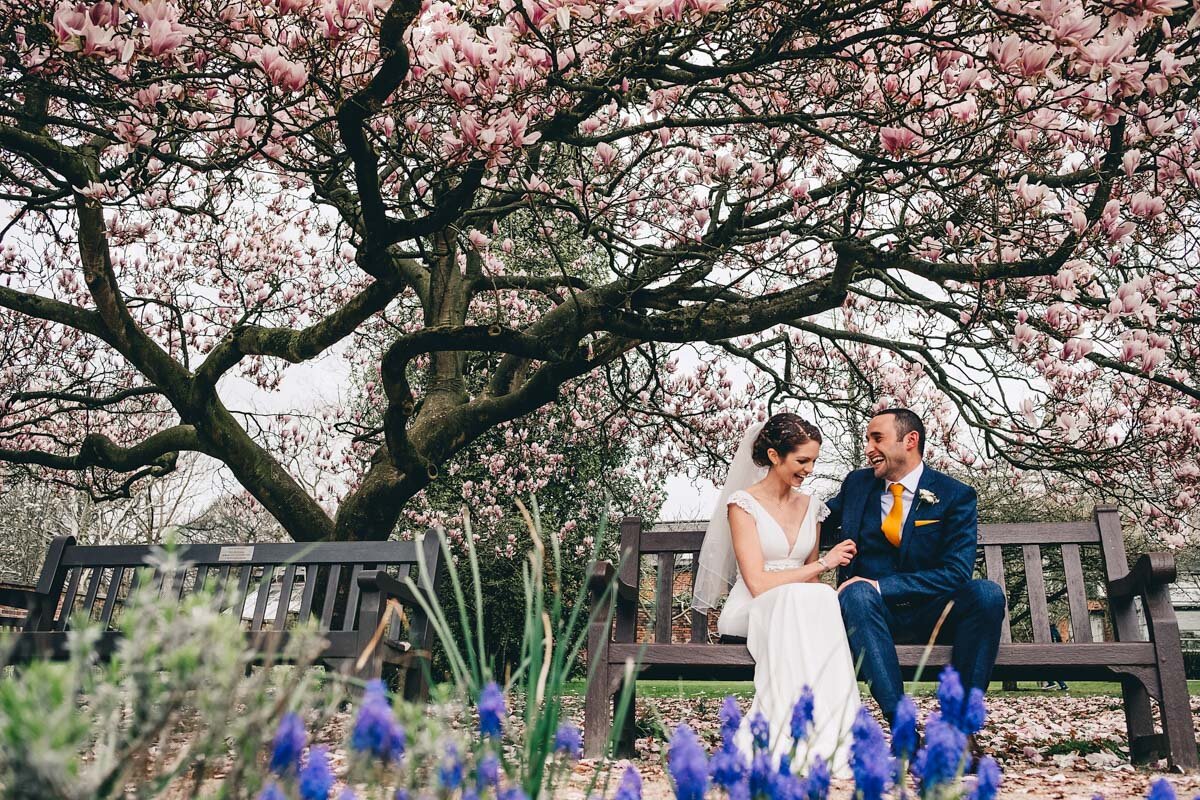 Bride and groom share a moment outside in the Parsonage Gardens