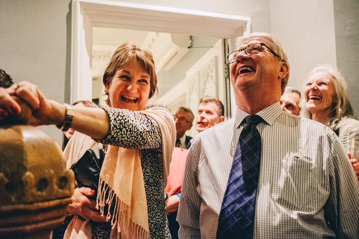 Guests laugh at wedding speeches