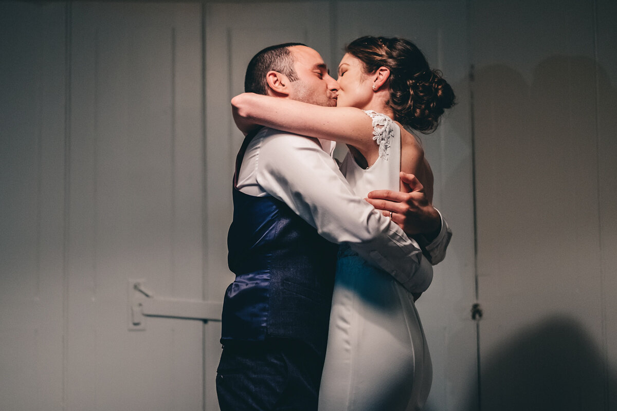 Bride and groom kiss at the end of the first dance