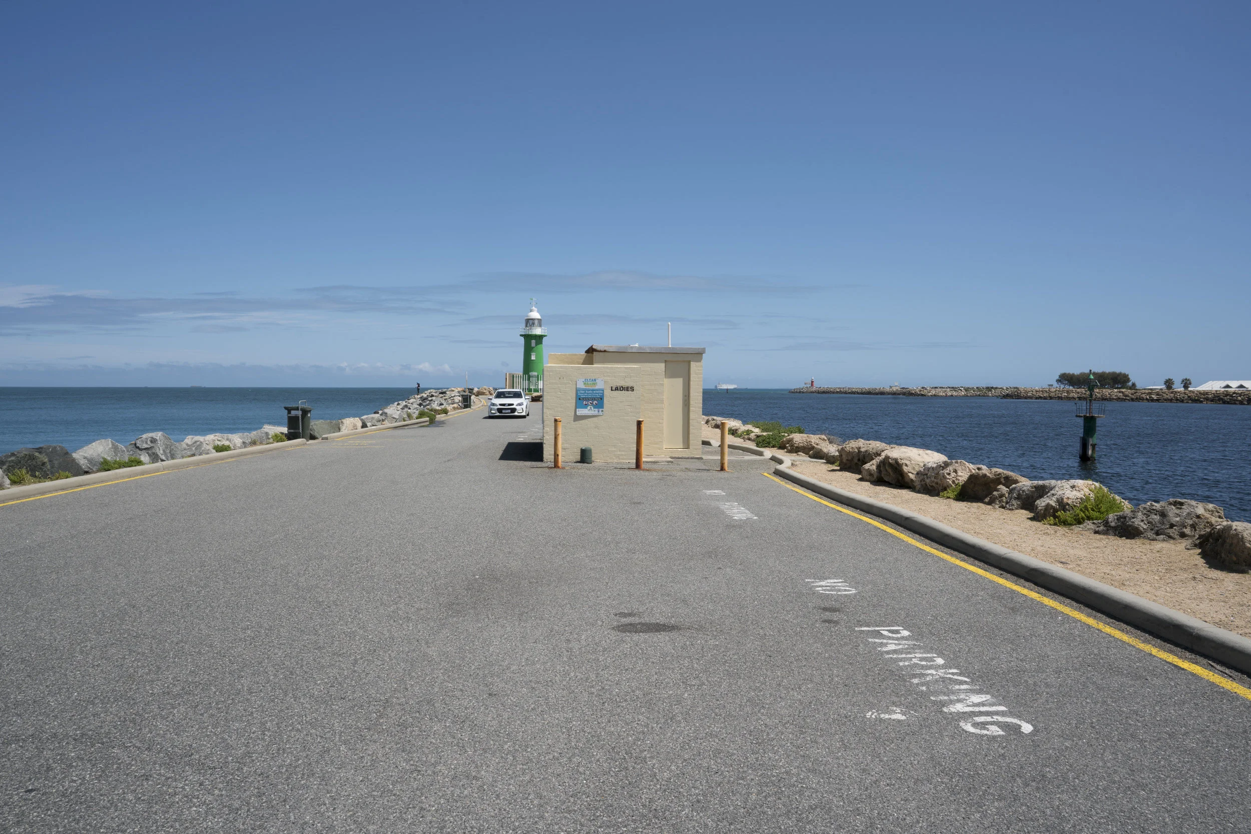 Plate 7: The lighthouse at the end of South Mole, also showing a narrow waking path and a toilet block