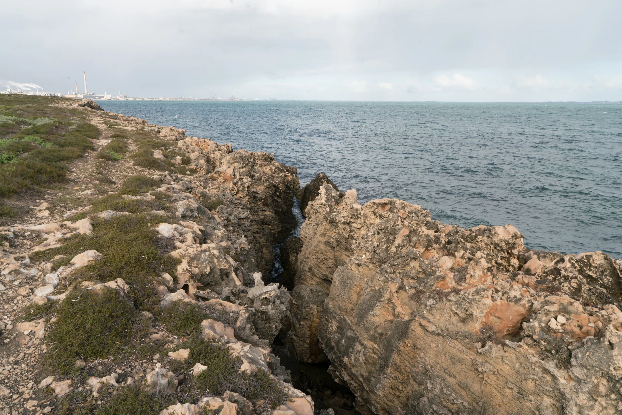 Plate 11: A section of the cliff eroding, breaking away and falling into the ocean