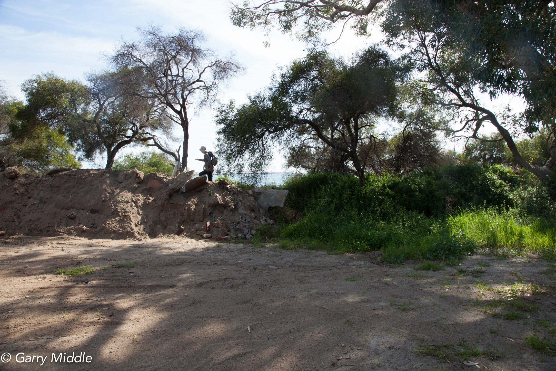 Plate 12: Accessing the beach at end of the make shift carpark at the western end of the boat club.