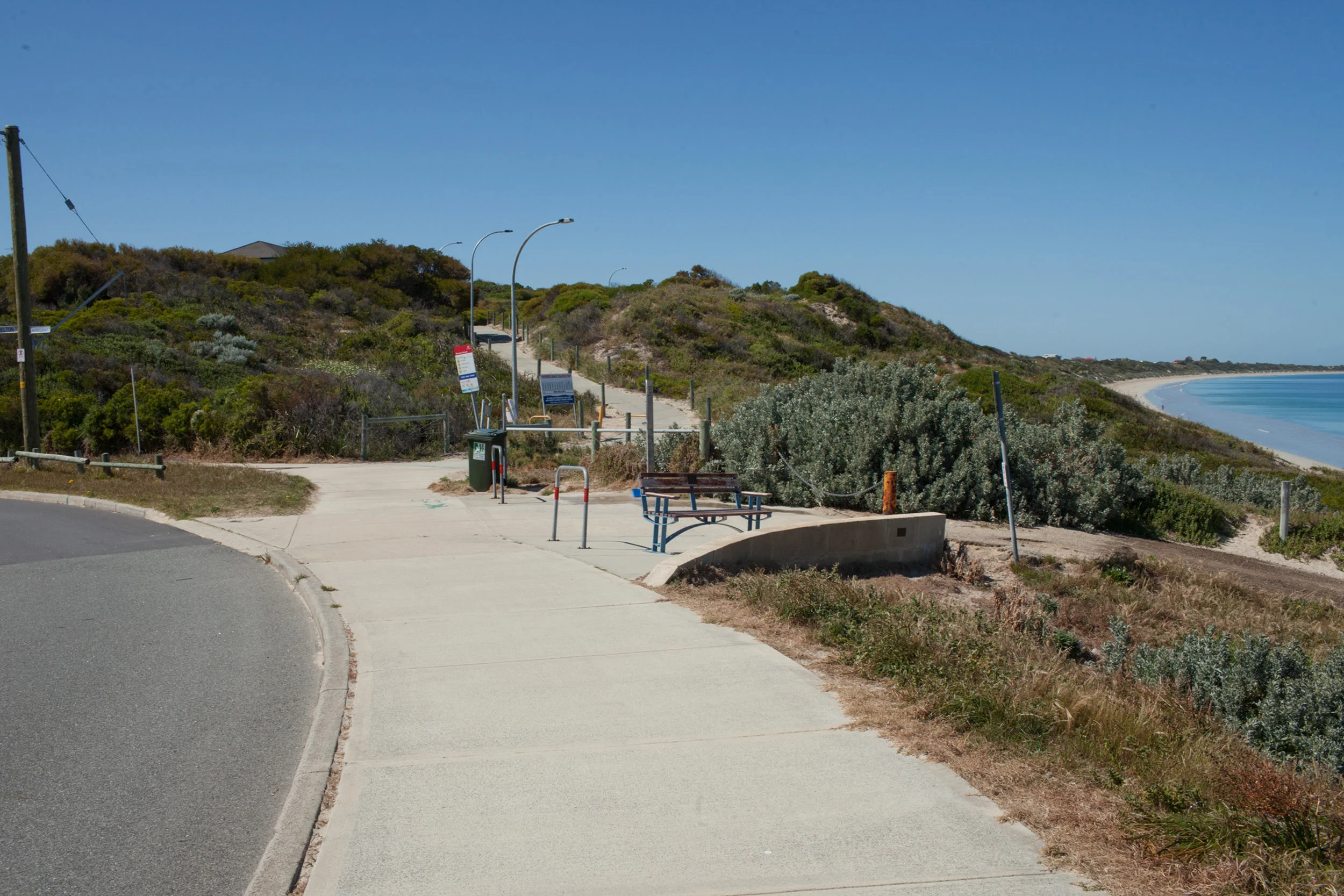 Plate 10: End of the walk showing the road bending left and the increased coastal setbacks.