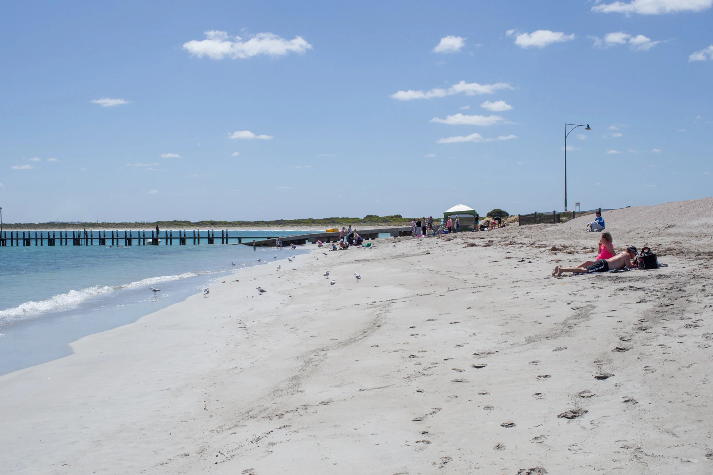 Plate 7: Families enjoying the beach adjacent to the Port Kennedy resort.