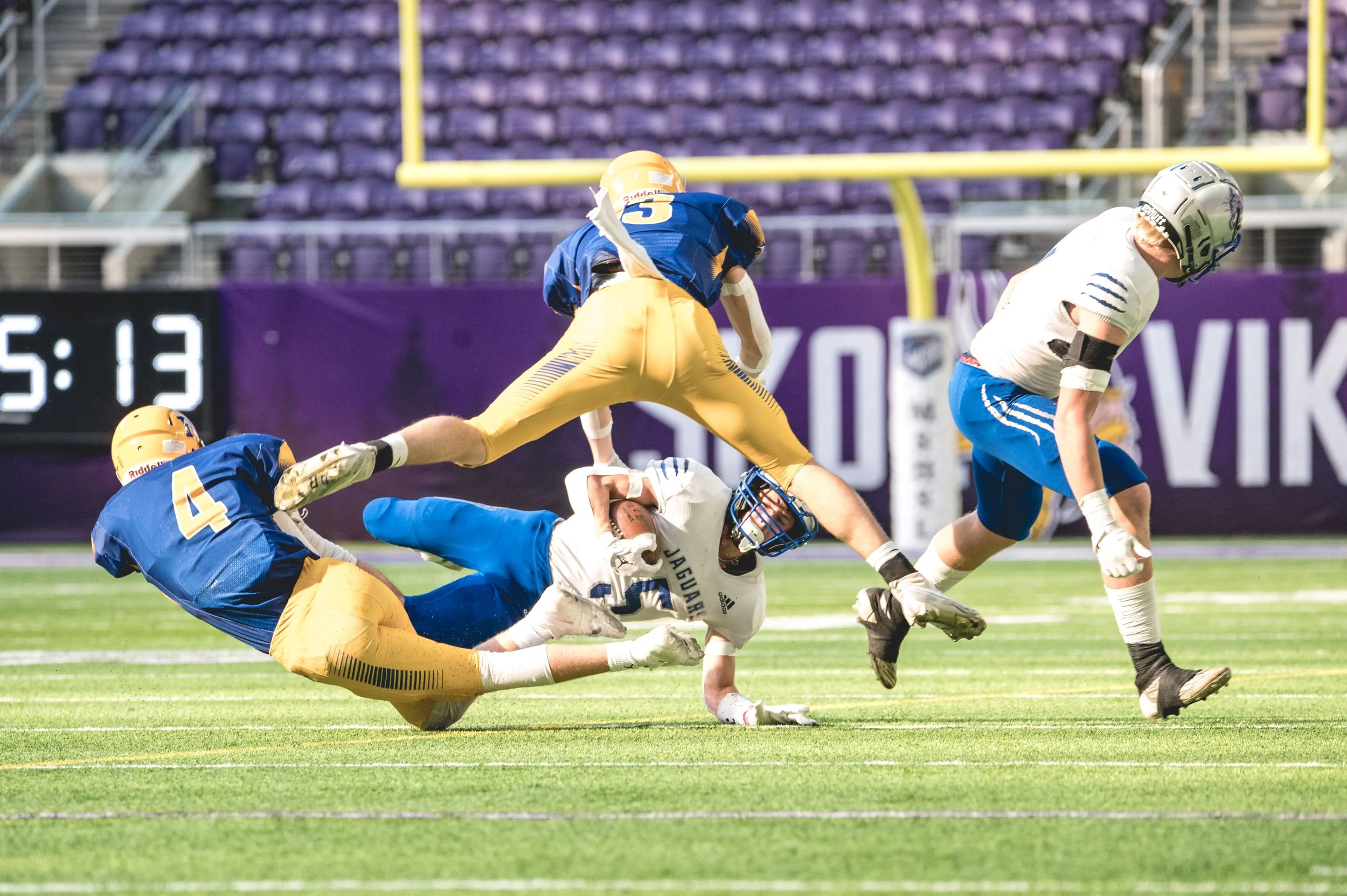 Max Rost and Keaton Jurens go airborn for a tackle.JPG