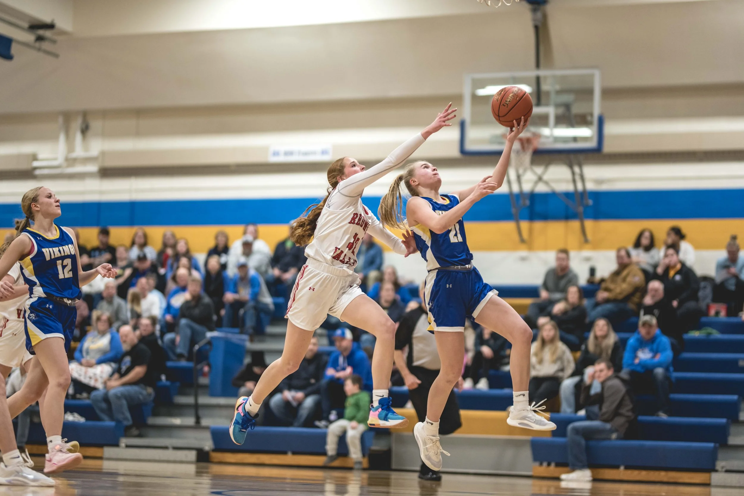 Ava Rost beats a Cardinal defender to the basket.JPG