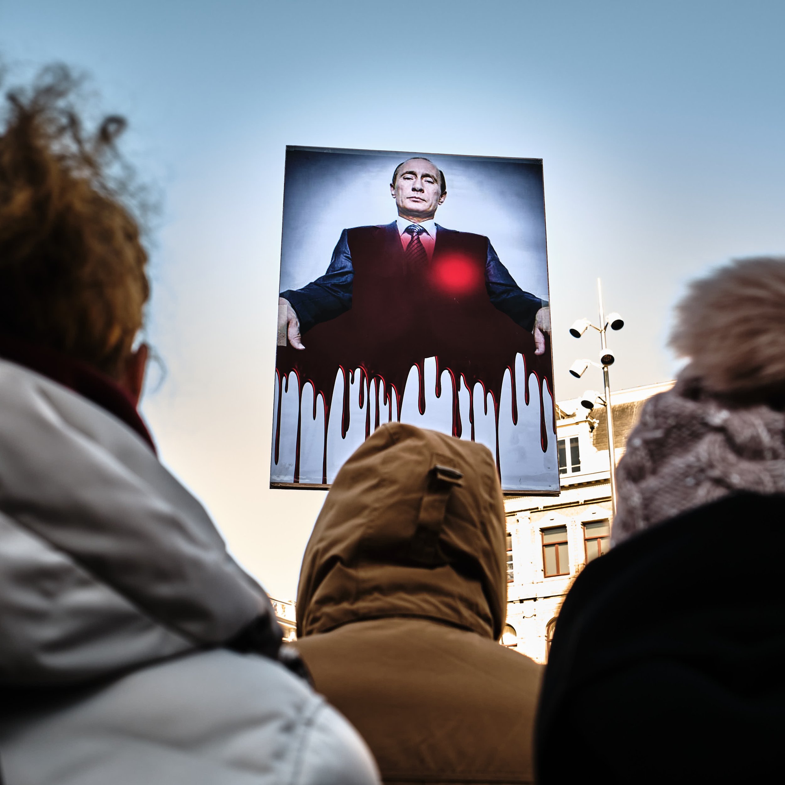  People protesting against Putin and the war he started in the Ukraine.  