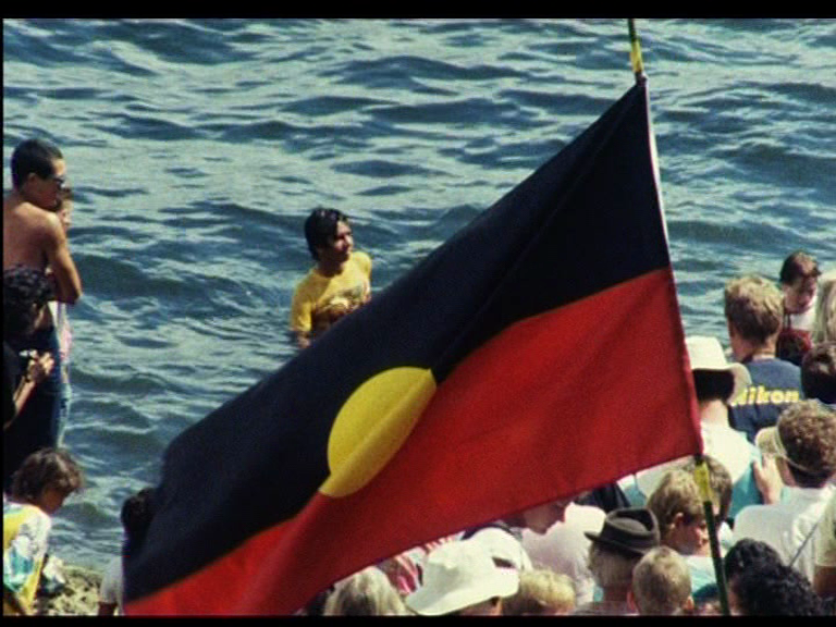 vlcsnap LR flag man in harbour.png