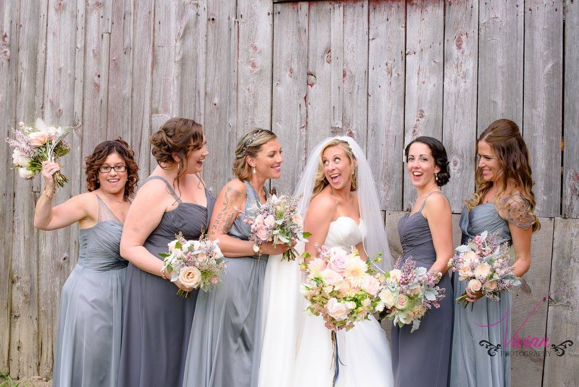 bridesmaids-posing-with-bride-on-wedding-day.jpg