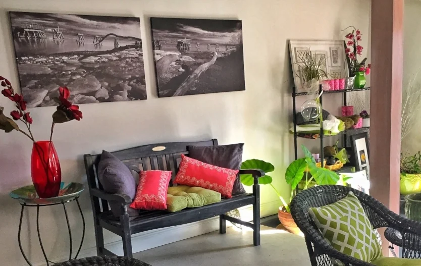 This is a portion of my portrait studio, when I'm feeling challenged, I feel the most motivated to get up and decorate! I like to switch things up but I always stay true to my core brand colors of pink, green, and black, it's very important to maintain that visual flow .