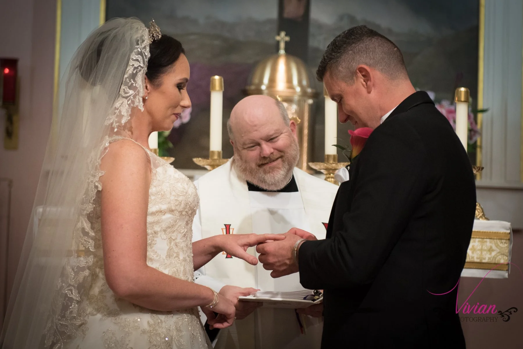 groom-putting-ring-on-bride.jpg