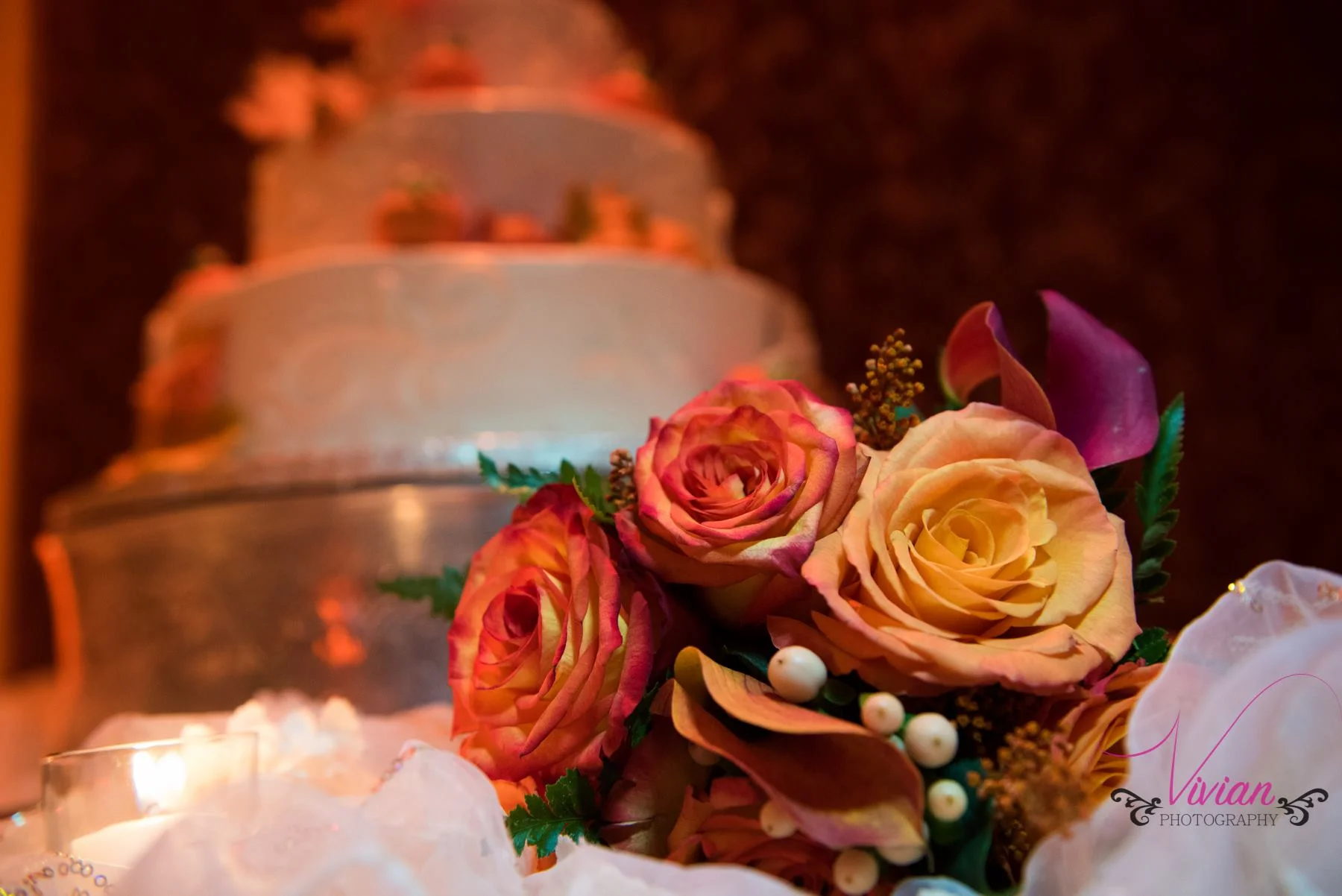 wedding-cake-in-background-bouquet-in-forefront.jpg