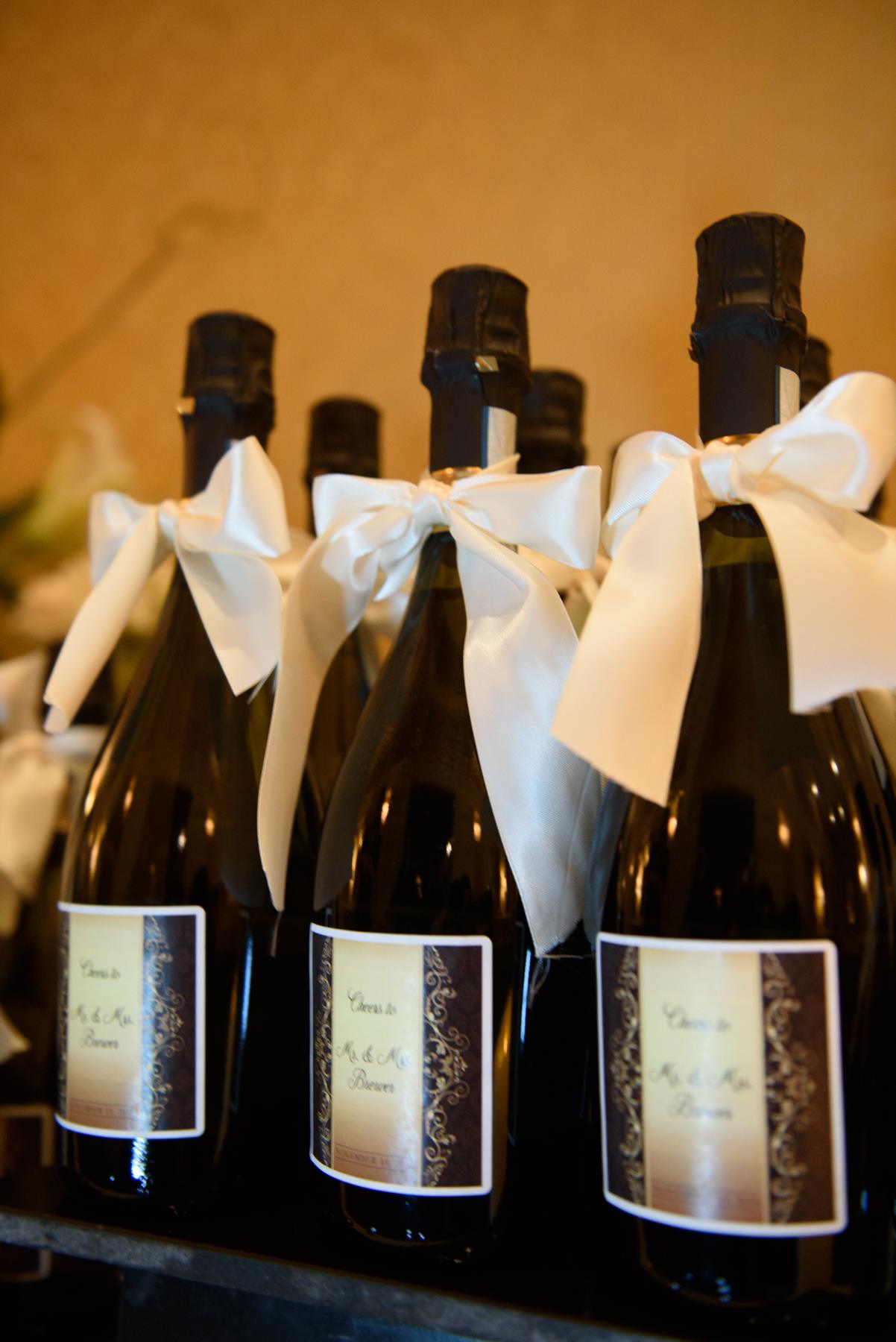 black-champagne-bottles-with-white-bows.jpg