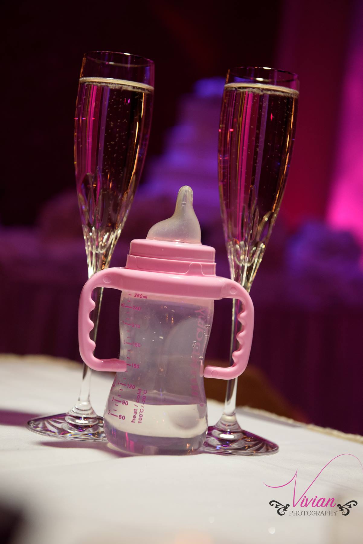 champagne-glasses-with-baby-bottle-between.jpg