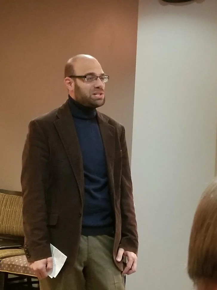President Eric Reisman giving a speech at the annual membership meeting