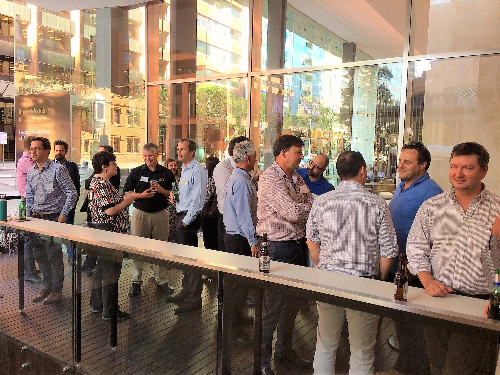 MICROMINE Geobank 2017 Launch attendees enjoying networking and a golden sunset on the CORE Deck.