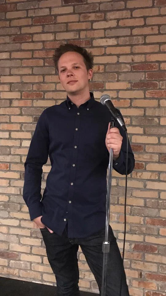Feedback Films - on stage with mic.jpg