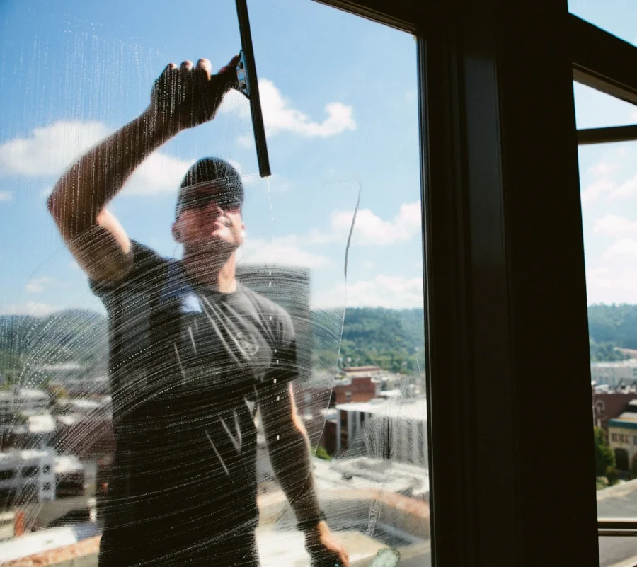 window cleaner through soapy window with bb&t building in background.jpg