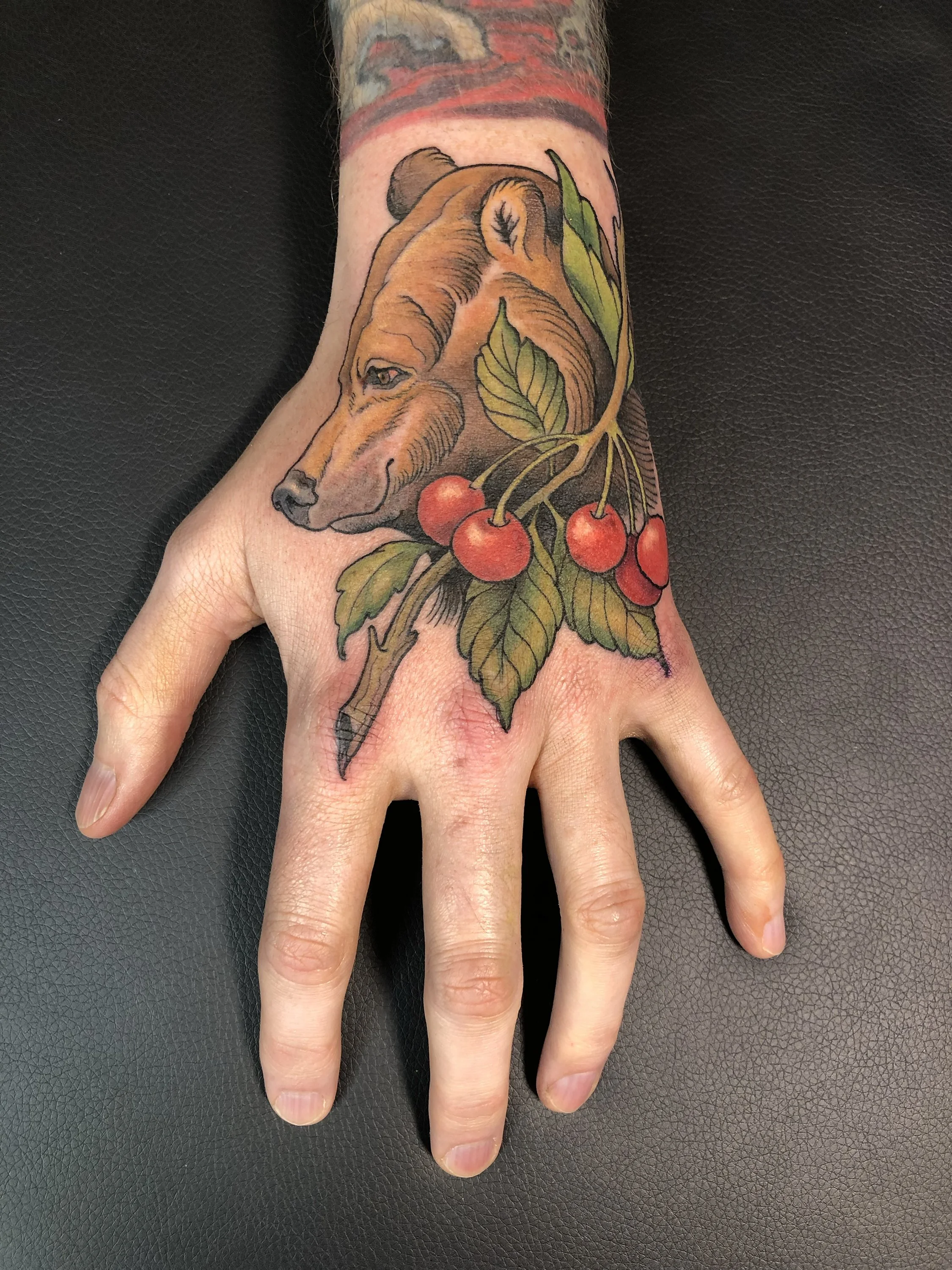 jared-bear-hand-tattoo2023.jpg