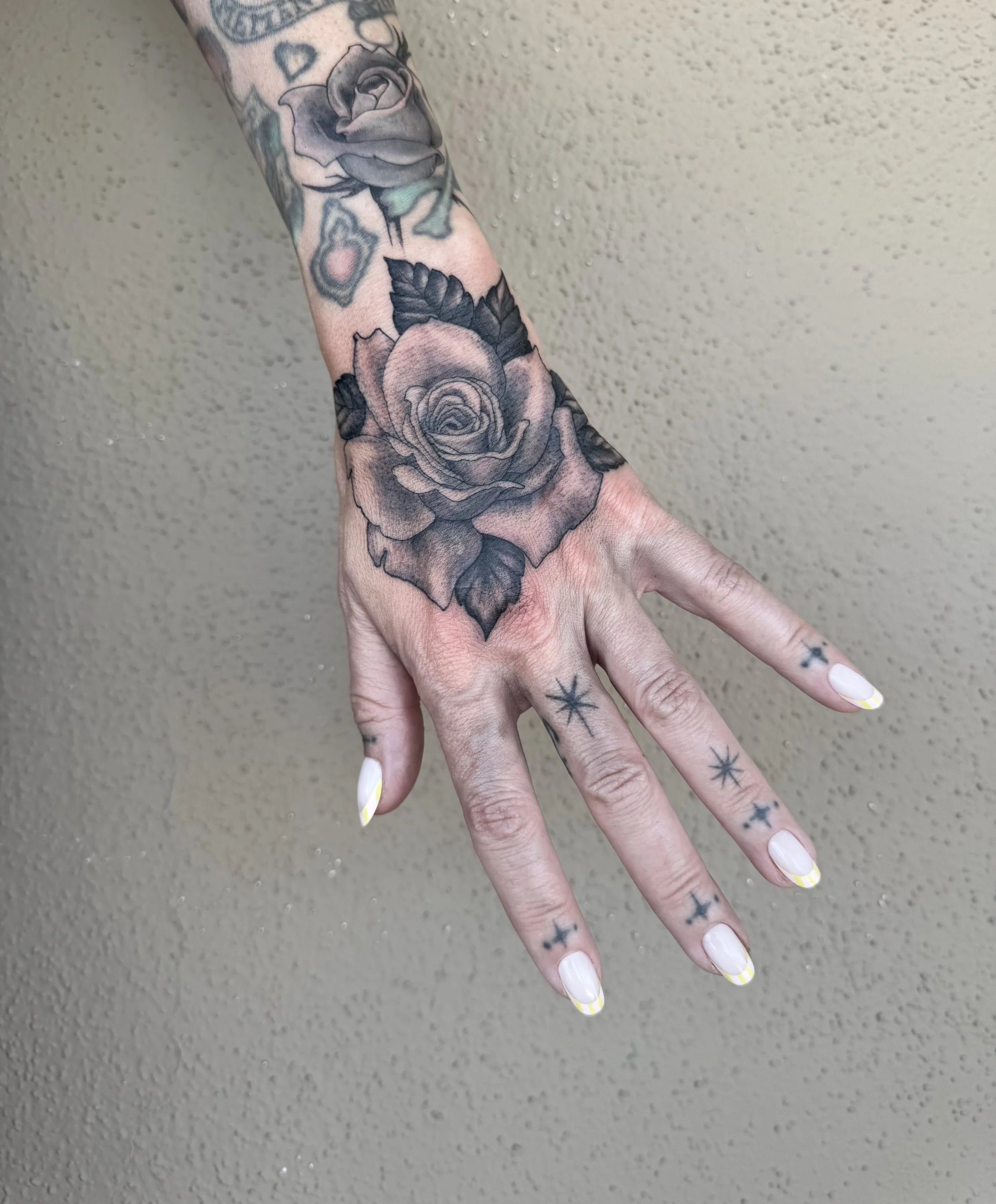 emily-flores-rose-hand2025.jpg