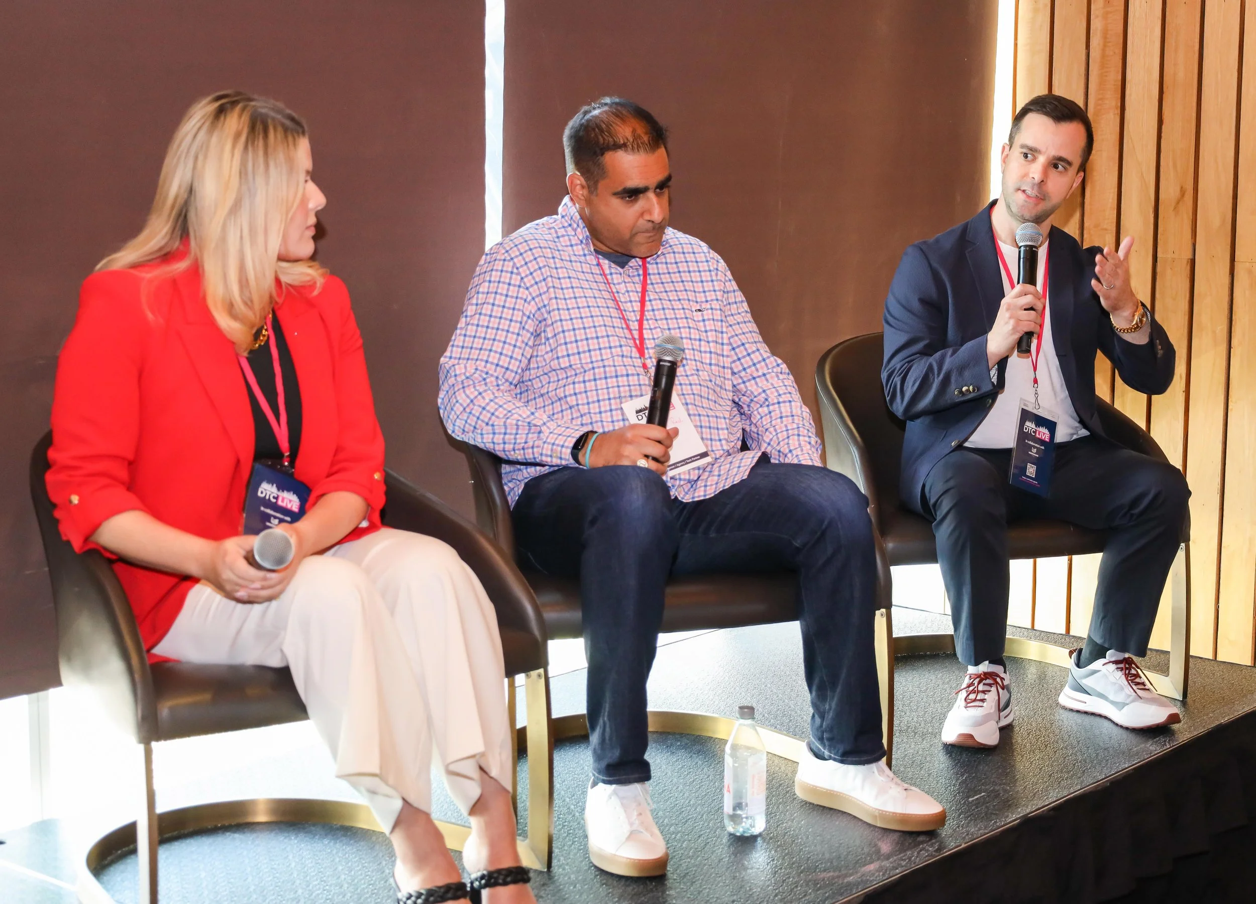 Image of Louis Monoyudis on stage speaking into microphone