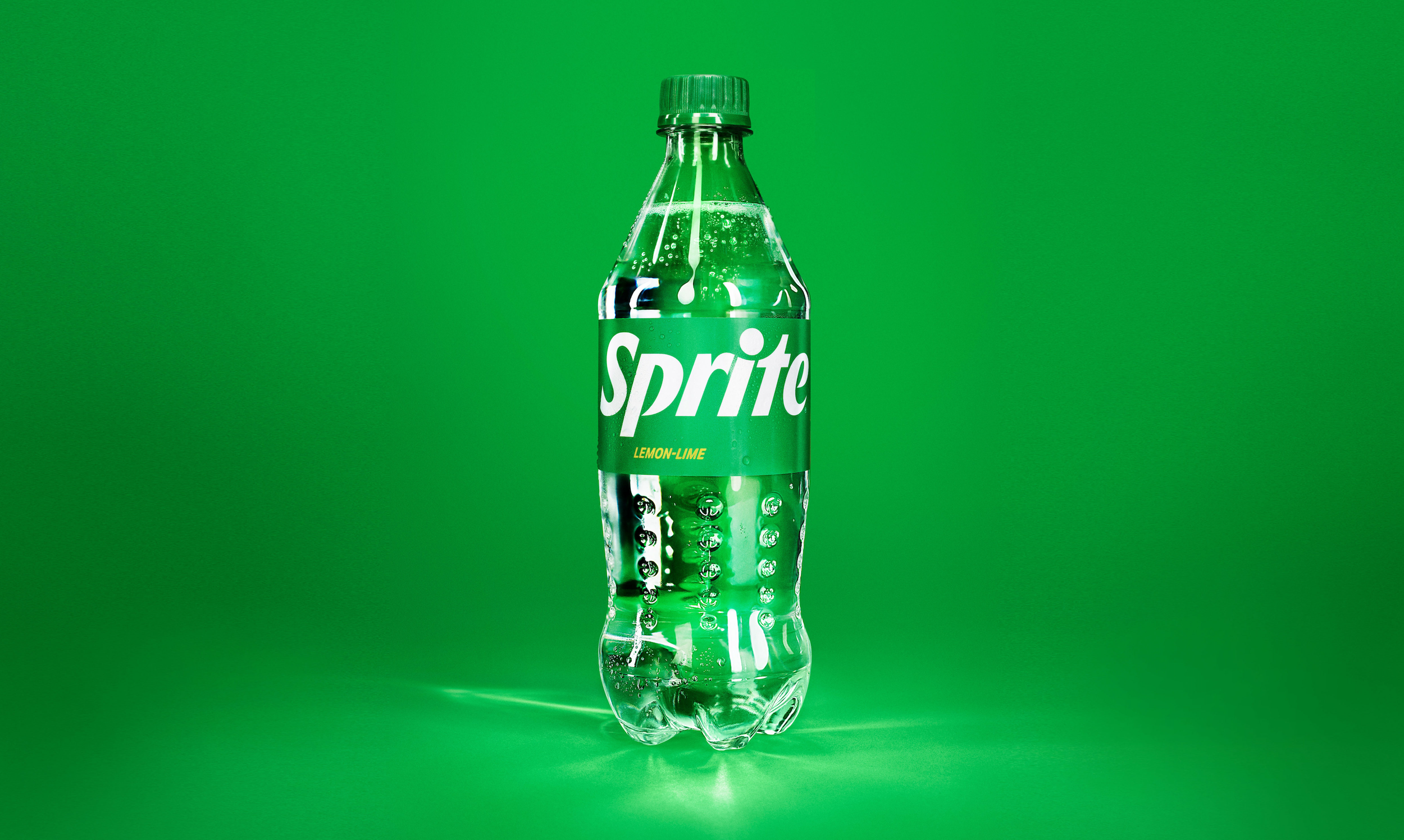 Image of a bottle of Sprite on a bright green background