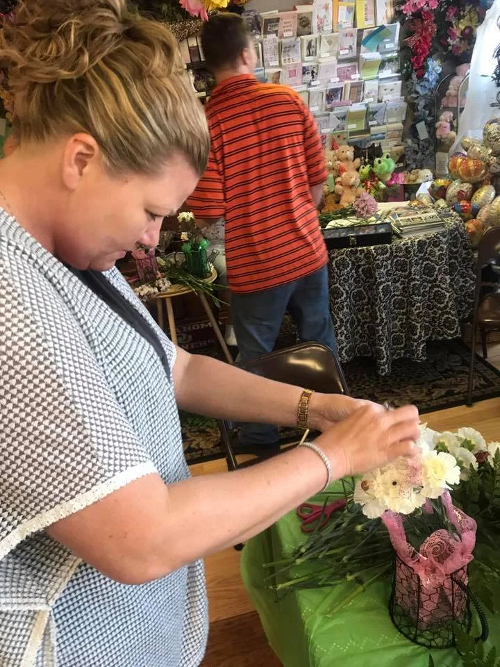 Shelley Owen working on her floral arrangement.