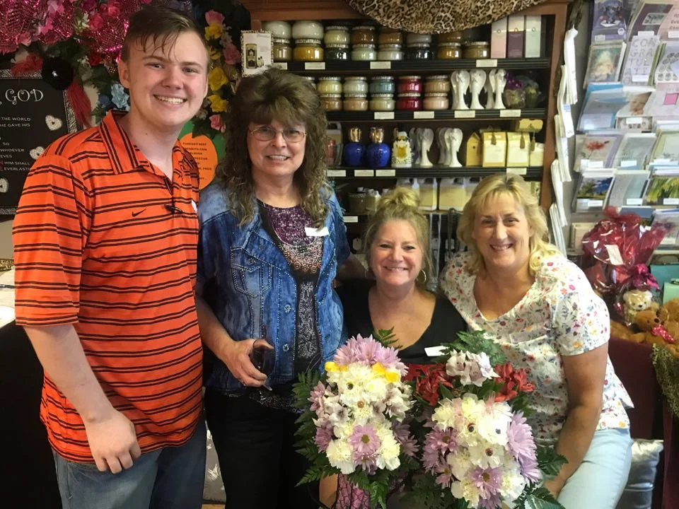 Forrest Freeman (PR and Delivery driver), Debbie Wesley, Mindy Skinner (patron who took the class) and Daryl Sandlan (floral design and deliveries).