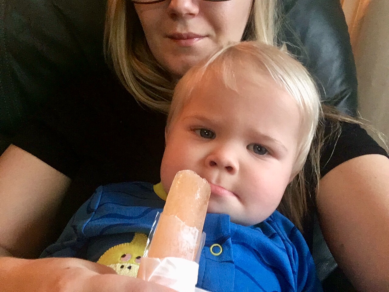Baby boy stubbornly refusing his Pedialyte popsicle.