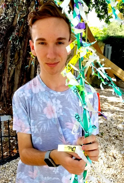 Joshua holding one of his creations.