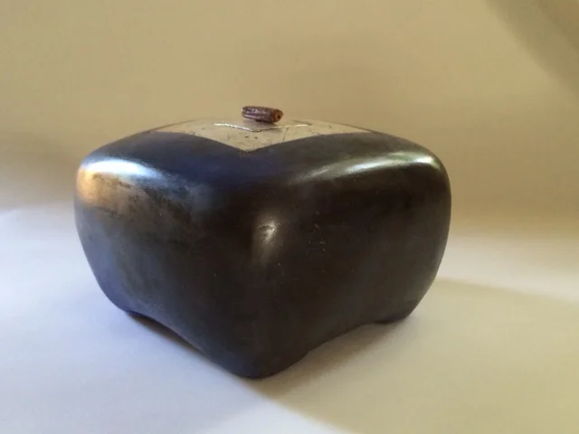 Small Black Box Made of terra cotta, burnished with terra sigillata and bound with waxed linen cording