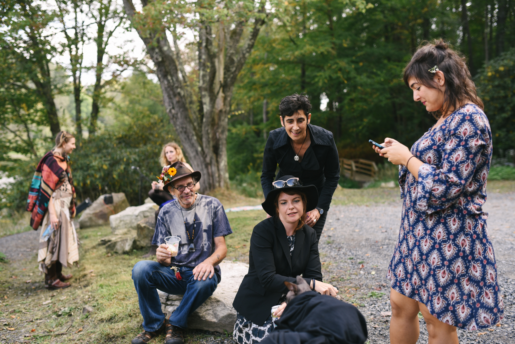  Mountain Wedding, Outdoors, Rustic, West Virginia, Maryland Wedding Photographer, DIY, Casual, guests chatting and watching cat in bowtie 