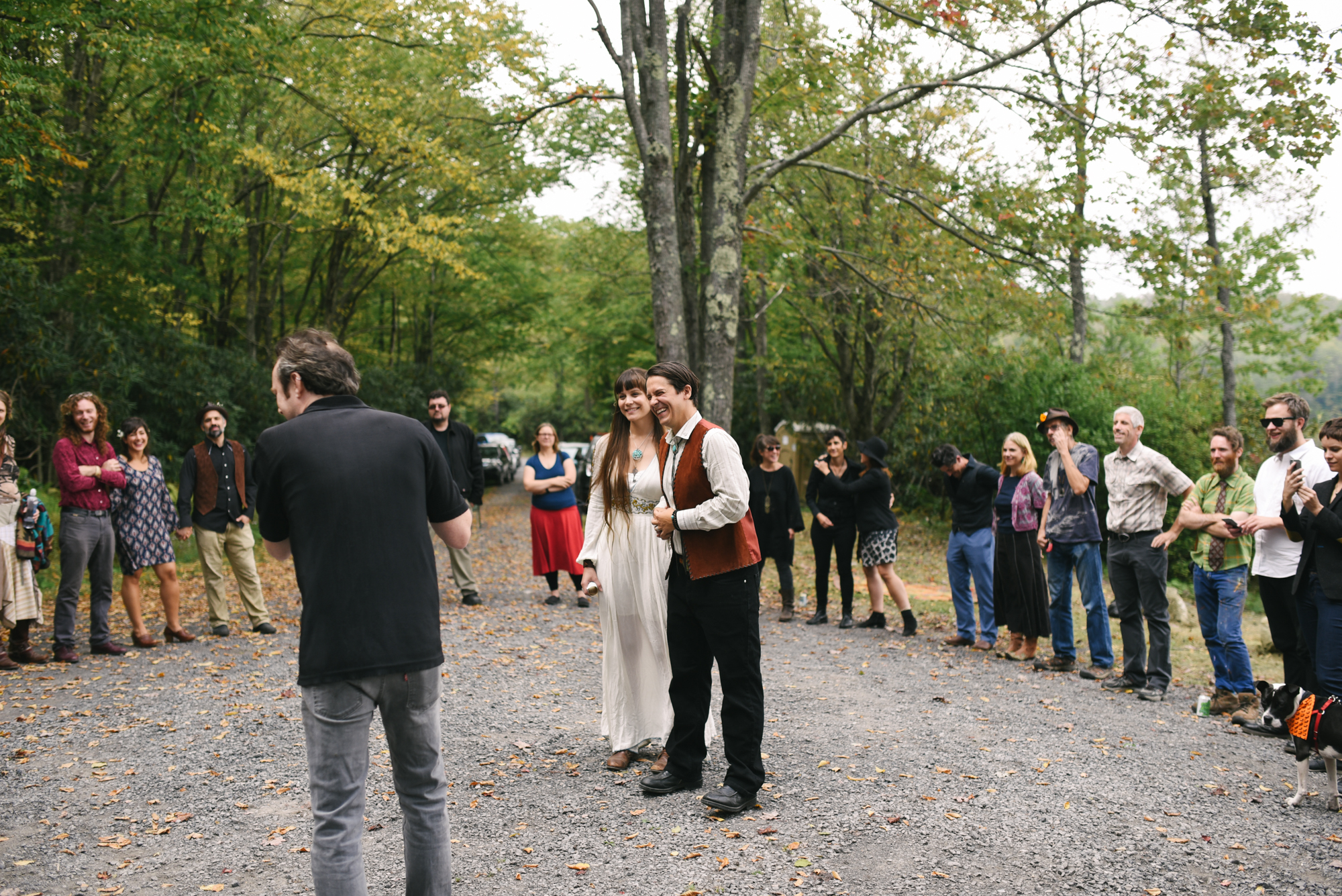  Mountain Wedding, Outdoors, Rustic, West Virginia, Maryland Wedding Photographer, DIY, Casual, Bride and groom laughing inside circle of friends and guests 