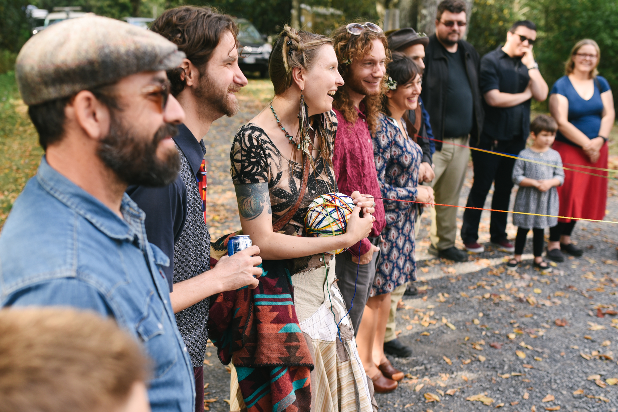  Mountain Wedding, Outdoors, Rustic, West Virginia, Maryland Wedding Photographer, DIY, Casual, Guests in yarn weaving ceremony 