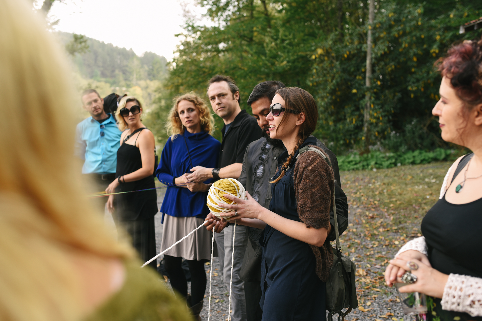  Mountain Wedding, Outdoors, Rustic, West Virginia, Maryland Wedding Photographer, DIY, Casual, taking part in yarn weaving ceremony 