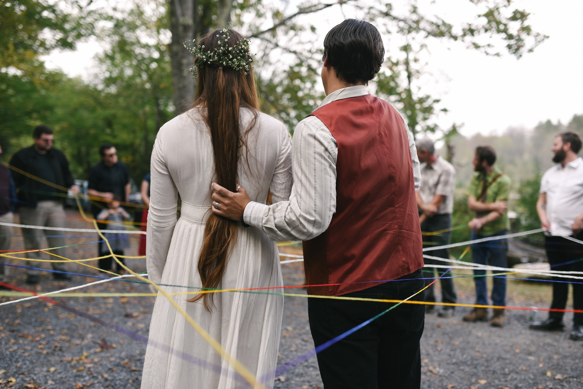  Mountain Wedding, Outdoors, Rustic, West Virginia, Maryland Wedding Photographer, DIY, Casual, bride and groom from behind in circle of guests, yarn weaving ceremony 