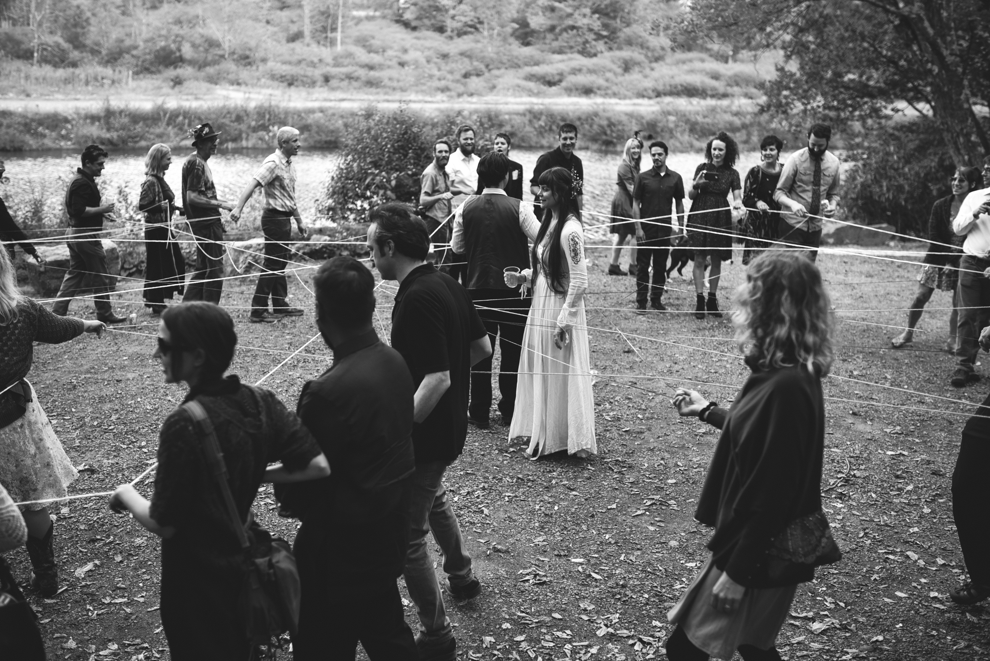  Mountain Wedding, Outdoors, Rustic, West Virginia, Maryland Wedding Photographer, DIY, Casual, black and white photo, bride and groom during yarn weaving ceremony 