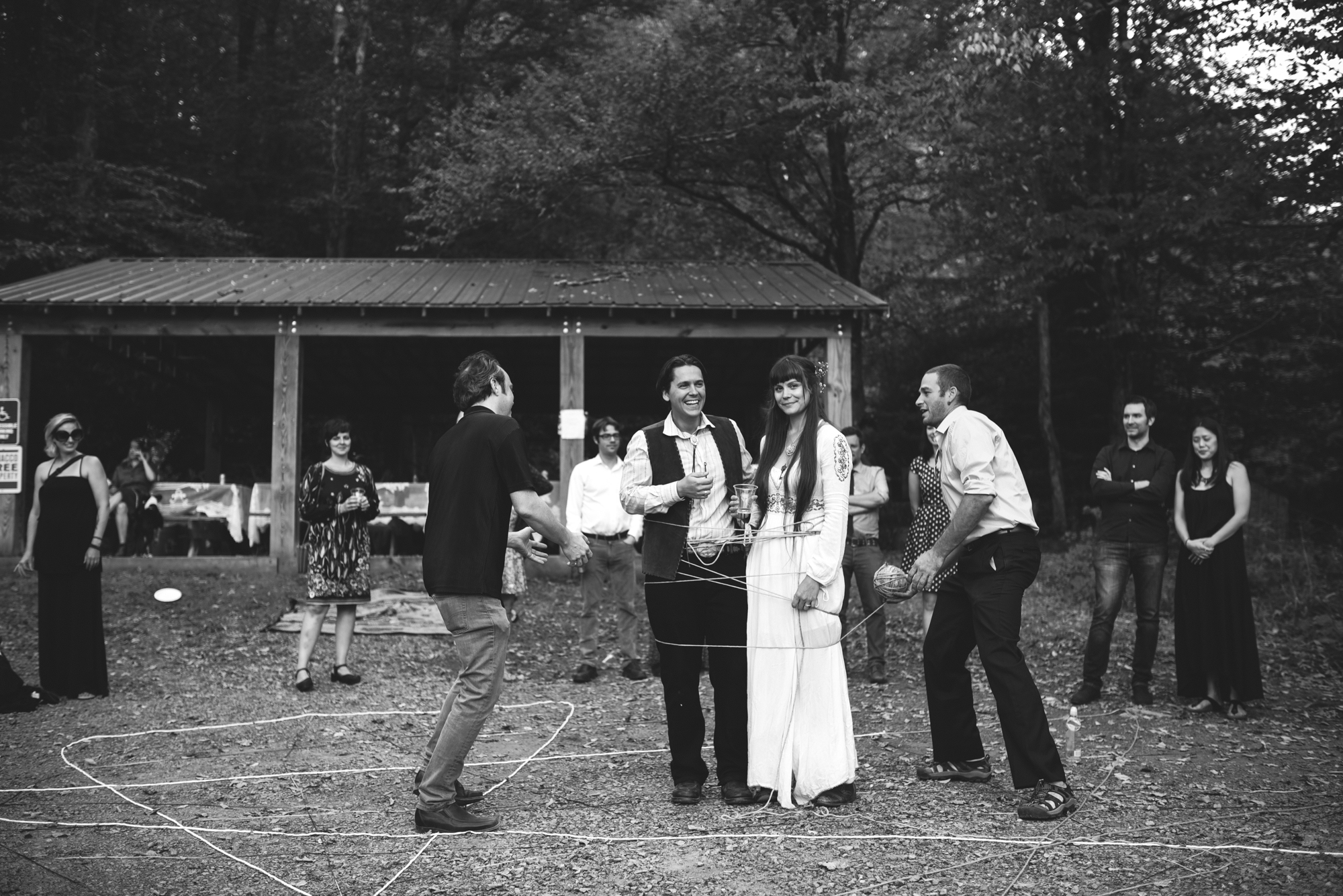  Mountain Wedding, Outdoors, Rustic, West Virginia, Maryland Wedding Photographer, DIY, Casual, bride and groom being joined with yarn, black and white photo, yarn ceremony 