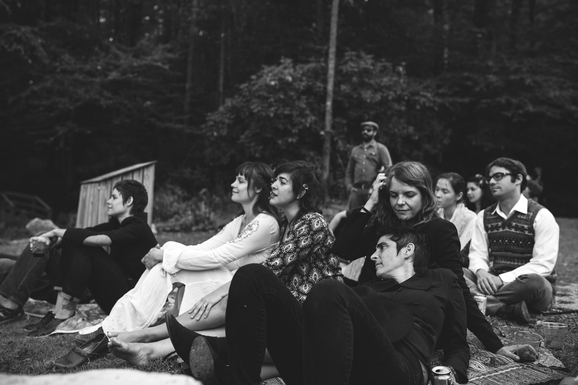  Mountain Wedding, Outdoors, Rustic, West Virginia, Maryland Wedding Photographer, DIY, Casual, black and white photo of bride and friends sitting in grass outside 